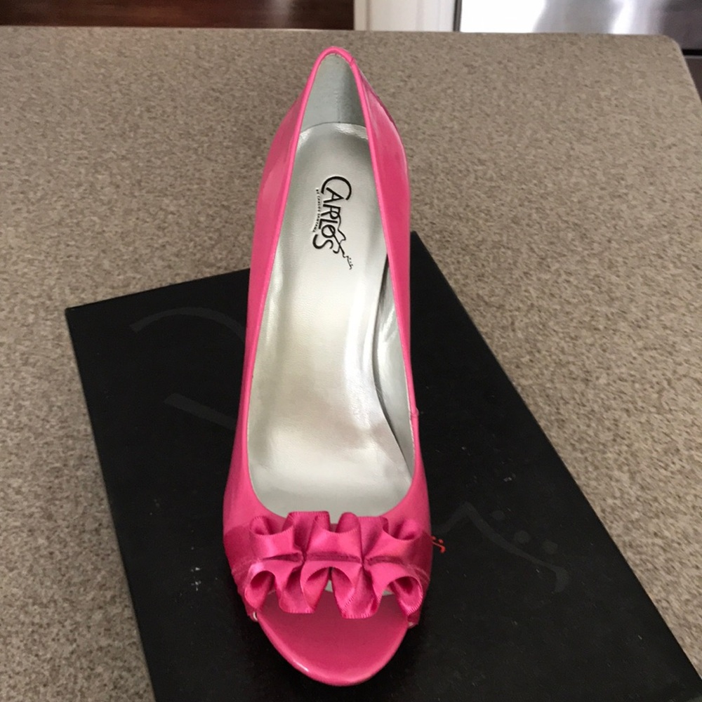 Carlos Santana pink high heels